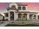 Charming two-story home boasting a well-manicured lawn and inviting entryway with a circular turret at 2501 S Roanoke St, Gilbert, AZ 85295