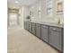Hallway featuring built-in cabinets for storage, light walls, carpet flooring, and natural light at 2501 S Roanoke St, Gilbert, AZ 85295