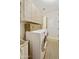 Bright laundry room with front-load washer/dryer, upper cabinets, and neutral decor at 2501 S Roanoke St, Gilbert, AZ 85295