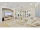 Inviting living room with a plush sectional sofa, a neutral color palette, and ample natural light at 2501 S Roanoke St, Gilbert, AZ 85295
