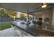 Outdoor kitchen with a bar, grill, and seating area perfect for enjoying the backyard and pool at 2501 S Roanoke St, Gilbert, AZ 85295