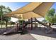 Shaded playground area with slides and climbing structures, providing a fun space for children at 2501 S Roanoke St, Gilbert, AZ 85295