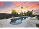 Backyard pool with elegant pavers, lush greenery, and comfortable lounge chairs for relaxed outdoor living at 2501 S Roanoke St, Gilbert, AZ 85295