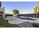 Beautiful backyard with a sparkling pool, lush landscaping, and relaxing lounge chairs at 2501 S Roanoke St, Gilbert, AZ 85295