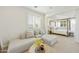 This light-filled sitting room features a plush sectional sofa, plantation shutters, and connects to the main bedroom at 2501 S Roanoke St, Gilbert, AZ 85295