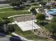 Overhead shot of a community park with a basketball court, sand volleyball court, and picnic areas at 2512 E Katrina Trl, Casa Grande, AZ 85194