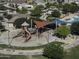 Overhead view of a playground, swimming pool, and covered seating areas in a neighborhood park at 2512 E Katrina Trl, Casa Grande, AZ 85194
