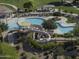 An overhead shot of a community pool with water slides and covered picnic tables at 2512 E Katrina Trl, Casa Grande, AZ 85194