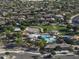 Community with lush green landscaping, large pool, winding water slides, and spacious homes at 2512 E Katrina Trl, Casa Grande, AZ 85194