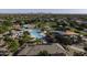 Aerial view of a community pool area, green spaces, playgrounds and neighborhood at 2512 E Katrina Trl, Casa Grande, AZ 85194