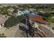 Aerial view of community park with pool, splash pad, picnic tables, playground amenities, and water slide features at 2512 E Katrina Trl, Casa Grande, AZ 85194