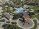 Aerial view of community park including pool, splash pad, picnic ramada, playground, basketball court, and volley ball court at 2512 E Katrina Trl, Casa Grande, AZ 85194