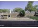 Spacious backyard with a built-in barbecue and lush landscaping at 2512 E Katrina Trl, Casa Grande, AZ 85194