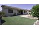 Backyard featuring a built-in barbecue and synthetic grass at 2512 E Katrina Trl, Casa Grande, AZ 85194