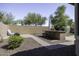 Backyard featuring a built-in bar, walkway, and gravel landscaping at 2512 E Katrina Trl, Casa Grande, AZ 85194