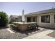 Backyard featuring a built-in island with bar stool seating and an umbrella at 2512 E Katrina Trl, Casa Grande, AZ 85194