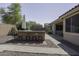Backyard featuring a built-in island with bar stool seating and an umbrella at 2512 E Katrina Trl, Casa Grande, AZ 85194