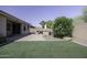 Backyard featuring a built-in barbecue and synthetic grass at 2512 E Katrina Trl, Casa Grande, AZ 85194