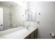 Bathroom with a long vanity and sink, toilet and tub with shower at 2512 E Katrina Trl, Casa Grande, AZ 85194