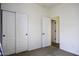 Bedroom showcasing carpet flooring with open and closet doors offering ample storage at 2512 E Katrina Trl, Casa Grande, AZ 85194