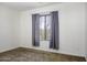 Neutral bedroom featuring a window with curtains and carpeted floors at 2512 E Katrina Trl, Casa Grande, AZ 85194