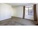 Empty bedroom with carpet flooring, a window, and neutral colored walls at 2512 E Katrina Trl, Casa Grande, AZ 85194