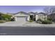 Charming single-story home featuring desert landscaping and a two-car garage, perfect for curb appeal at 2512 E Katrina Trl, Casa Grande, AZ 85194