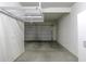 Spacious garage featuring a hanging storage shelf at 2512 E Katrina Trl, Casa Grande, AZ 85194