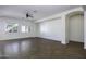 Spacious living room boasting tile flooring, natural light, and a contemporary ceiling fan at 2512 E Katrina Trl, Casa Grande, AZ 85194