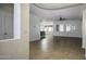 Open living space with tiled floors, a ceiling fan, and ample natural light from the windows at 2512 E Katrina Trl, Casa Grande, AZ 85194