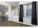 Cozy living area with tiled flooring, large windows, and stylish curtains, perfect for relaxing at 2512 E Katrina Trl, Casa Grande, AZ 85194