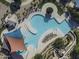 Aerial view of community pool and waterslide, a recreational space for neighborhood residents in a Gathering-friendly environment at 2512 E Katrina Trl, Casa Grande, AZ 85194