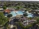 Aerial view of community pool featuring water slides, splash pad, shaded seating, and Gathering-friendly recreational space at 2512 E Katrina Trl, Casa Grande, AZ 85194