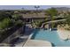 Community pool featuring a large slide and neighboring landscaping and clubhouse in a well kept neighborhood at 2512 E Katrina Trl, Casa Grande, AZ 85194