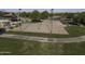 Aerial view of community park volleyball court near Gathering picnic area, playground, and community pool amenities at 2512 E Katrina Trl, Casa Grande, AZ 85194