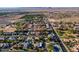An aerial view of a neighborhood showcasing the house, its surroundings, and nearby mountains at 2625 N 24Th St # 15, Mesa, AZ 85213