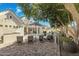 Beautiful backyard offers a lounge area, patio, pool, mature landscaping, and lush greenery at 2625 N 24Th St # 15, Mesa, AZ 85213