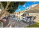 Luxurious backyard features a pool, spa, BBQ area, lounge chairs, and shade trees at 2625 N 24Th St # 15, Mesa, AZ 85213