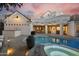 Serene backyard with a pristine pool, spa, lush landscaping, and comfortable seating, offering a tranquil retreat at 2625 N 24Th St # 15, Mesa, AZ 85213