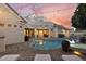 Stunning backyard featuring a pool, spa, outdoor seating, and meticulous landscaping perfect for entertainment at 2625 N 24Th St # 15, Mesa, AZ 85213