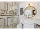 Bright bathroom boasts a decorative mirror, accent wall and a glass-enclosed tiled shower at 2625 N 24Th St # 15, Mesa, AZ 85213