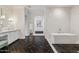 Elegant bathroom with marble accents, a freestanding tub, and modern fixtures at 2625 N 24Th St # 15, Mesa, AZ 85213