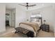 Bright bedroom with neutral tones features a ceiling fan and a decorative upholstered bench at 2625 N 24Th St # 15, Mesa, AZ 85213