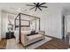 Serene bedroom featuring a four-poster bed, ample natural light, and sophisticated design at 2625 N 24Th St # 15, Mesa, AZ 85213