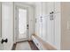 Well-organized entryway features storage cabinets, a bench, and stylish decor at 2625 N 24Th St # 15, Mesa, AZ 85213