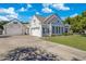 Beautiful home featuring a three-car garage, manicured landscaping, and a lush green lawn at 2625 N 24Th St # 15, Mesa, AZ 85213