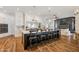 Spacious kitchen featuring an expansive island with barstool seating and modern lighting fixtures at 2625 N 24Th St # 15, Mesa, AZ 85213