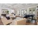 Elegant living room with a view to the backyard, coffered ceiling, and a grand piano at 2625 N 24Th St # 15, Mesa, AZ 85213
