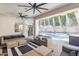 Inviting outdoor living space includes a patio, misting system, and comfortable seating by the pool at 2625 N 24Th St # 15, Mesa, AZ 85213