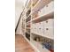 Well-organized pantry with custom shelving and sliding ladder for easy access to stored goods at 2625 N 24Th St # 15, Mesa, AZ 85213